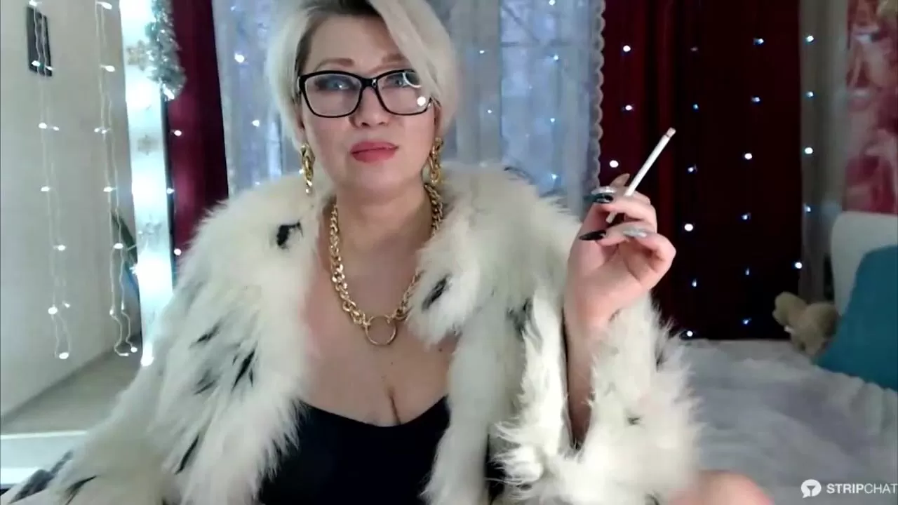 Gorgeous Russian mom smokes in a fur coat and dominates)) watch online image